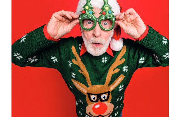 eyemax winter Mann mit kreativer Weihnachtsbrille und Ugly Pullover